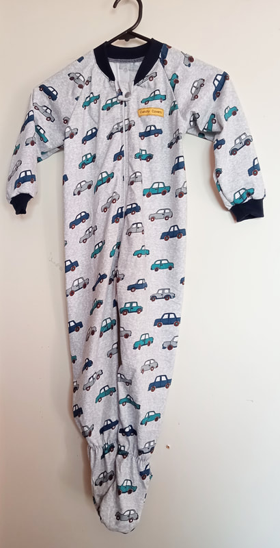 Boy's onesie pyjama with feet made from organic cotton.