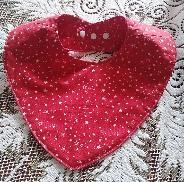 Xmas cotton bib, reversible with 3 adjustable snap studs each side.