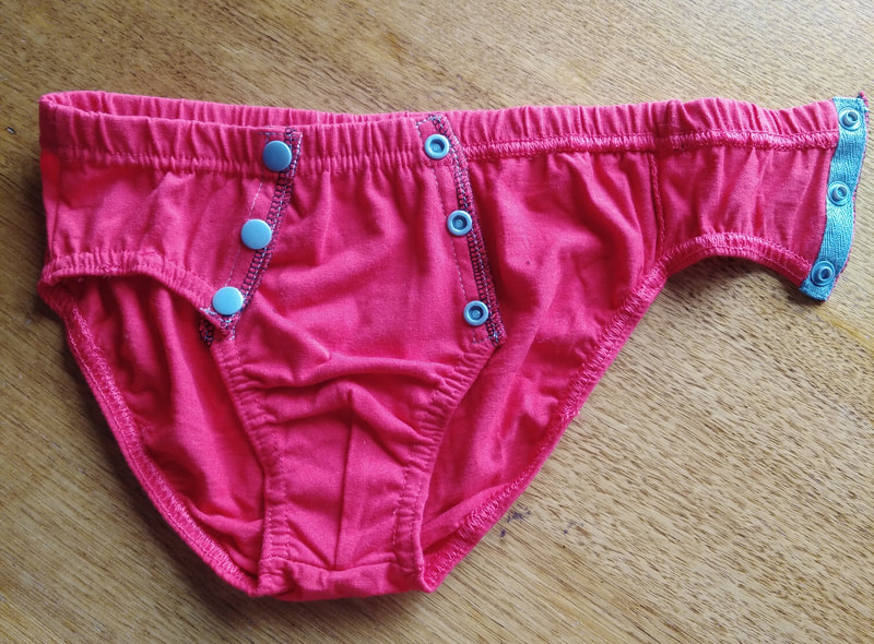 Toilet training pants with snaps.